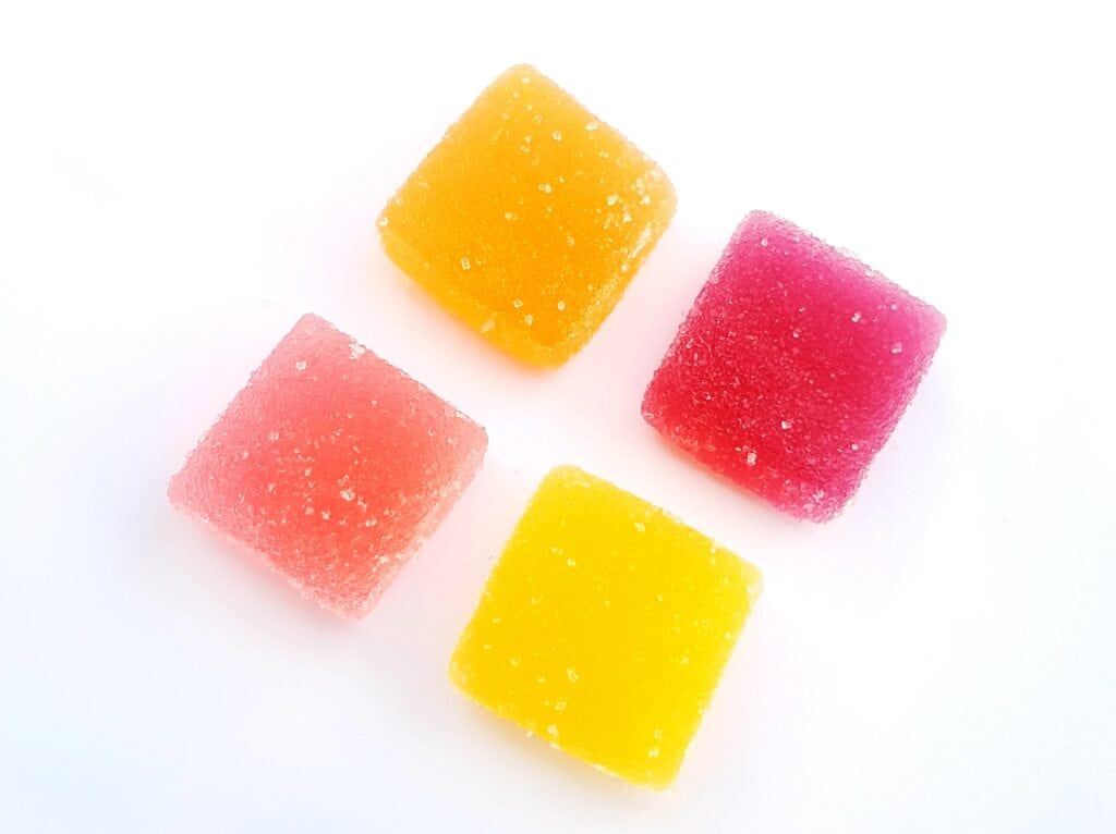 Colorful gummies on white background