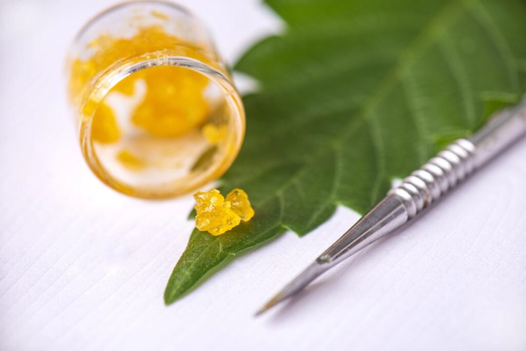 live resin in jar, small amount on leaf